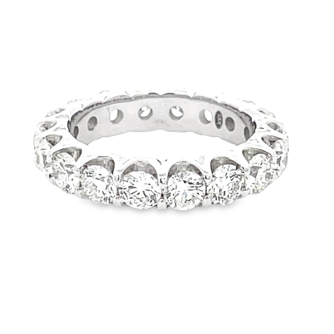 Eternity band in 18K WG with prong set (18) round diamonds.  D3.66ct.t.w.  Size 6.5