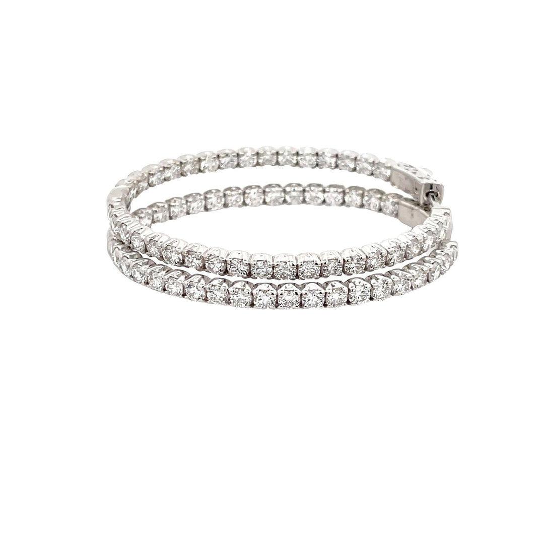 2"" Oval shaped inside out hoop earrings with prong set (70) round diamonds.  D4.85ct.t.w.