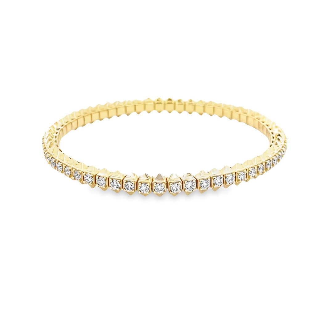 Flex tennis bangle in 18K YG with prong set (58) round diamonds.  D2.93ct.t.w.
