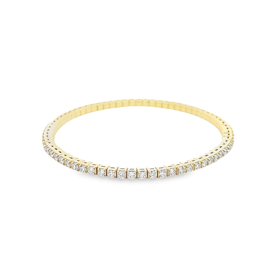 Flex tennis bangle in 18K YG with prong set (70) round diamonds.  D2.65ct.t.w.