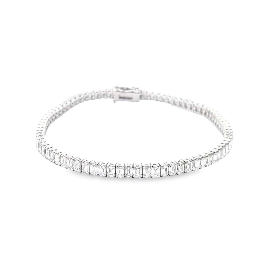 7"" Tennis bracelet in 18K WG with basket prong set (80) emerald cut diamonds. D7.72ct.t.w.