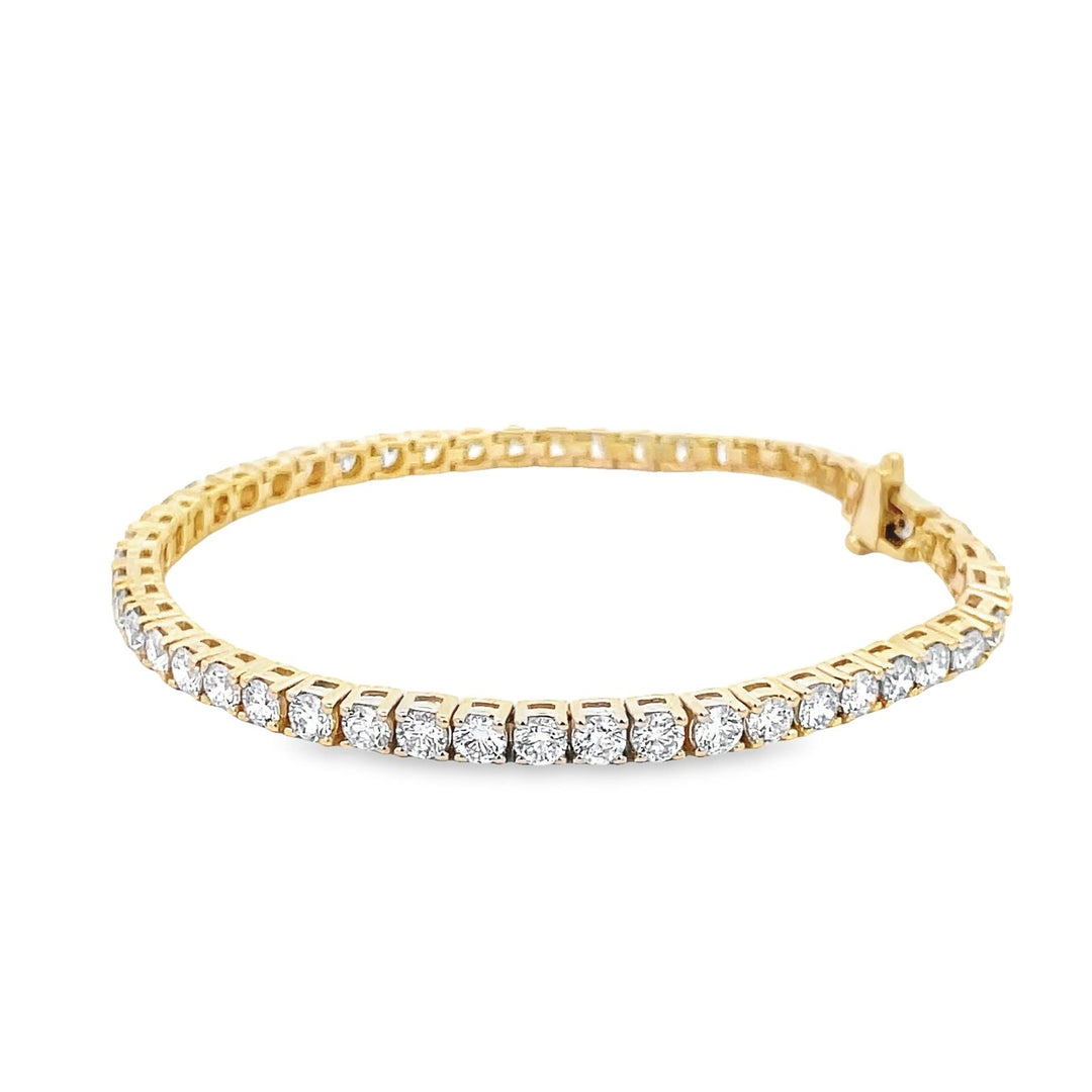7"" Tennis bracelet in 18K YG with open basket prong set (50) round diamonds.  D7.29ct.t.w.